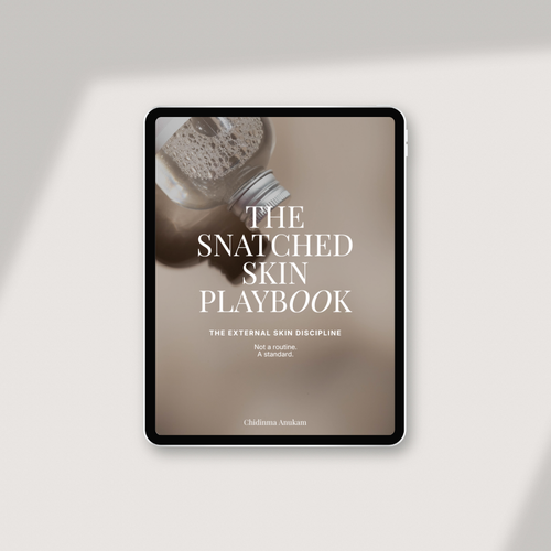 A tablet device displaying a book cover titled "The Snatched Skin Playbook" on a light beige background with soft diagonal shadows.